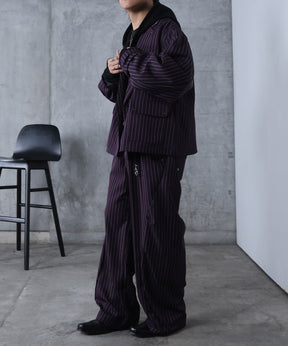 スラックス スタッズ カーブパンツ