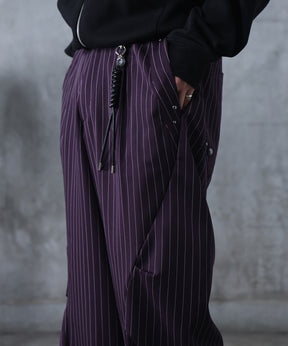 スラックス スタッズ カーブパンツ