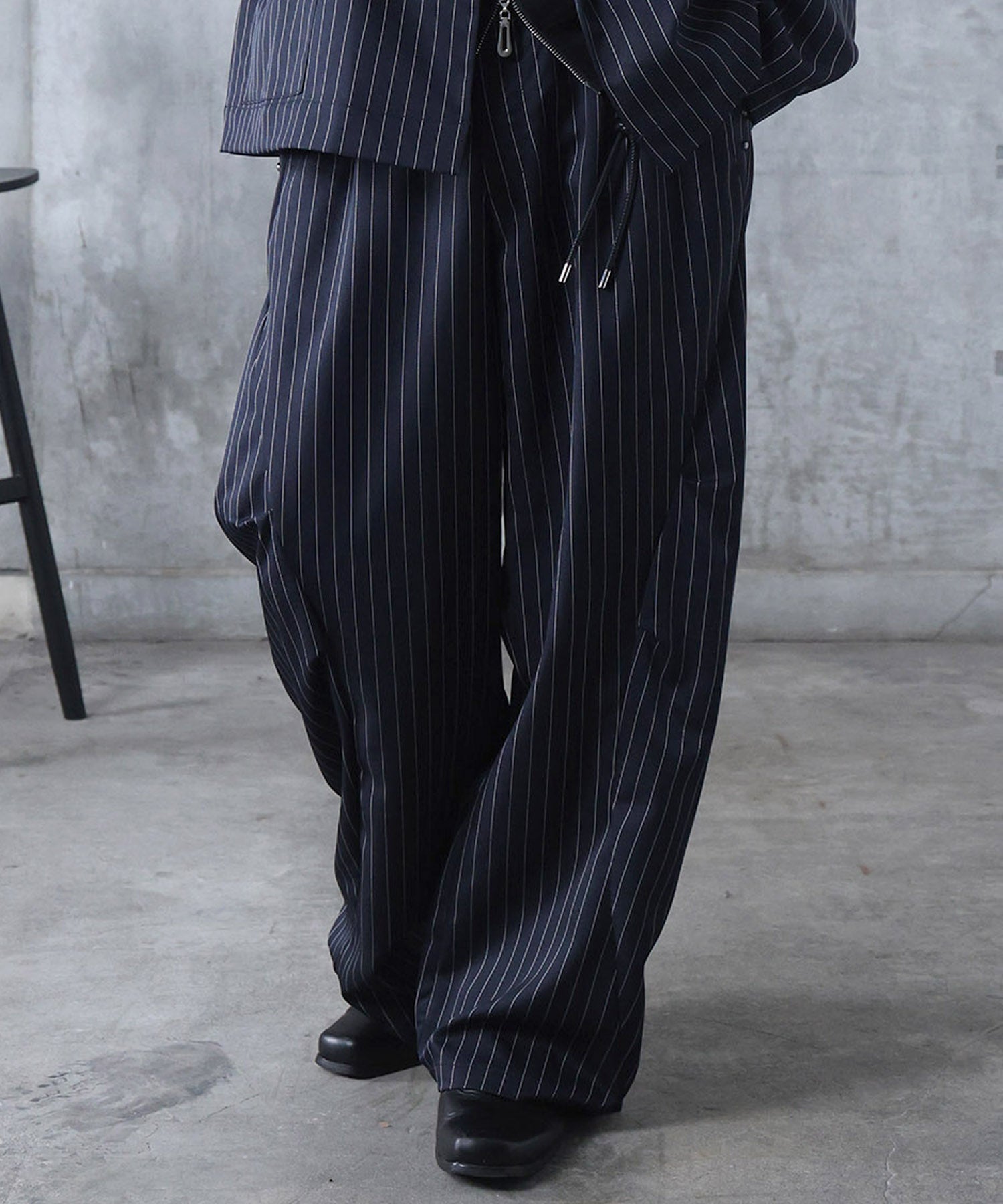 スラックス スタッズ カーブパンツ