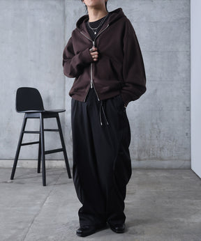 スラックス スタッズ カーブパンツ