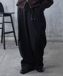 スラックス スタッズ カーブパンツ