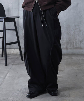 スラックス スタッズ カーブパンツ