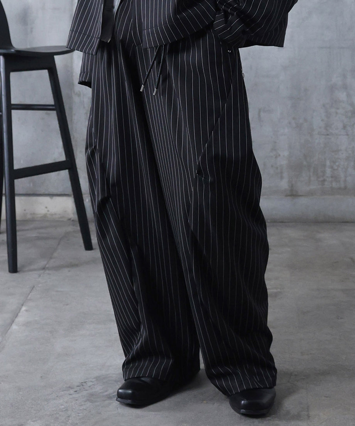 スラックス スタッズ カーブパンツ