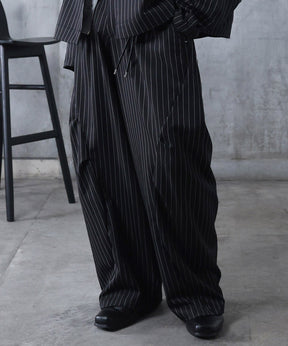 スラックス スタッズ カーブパンツ