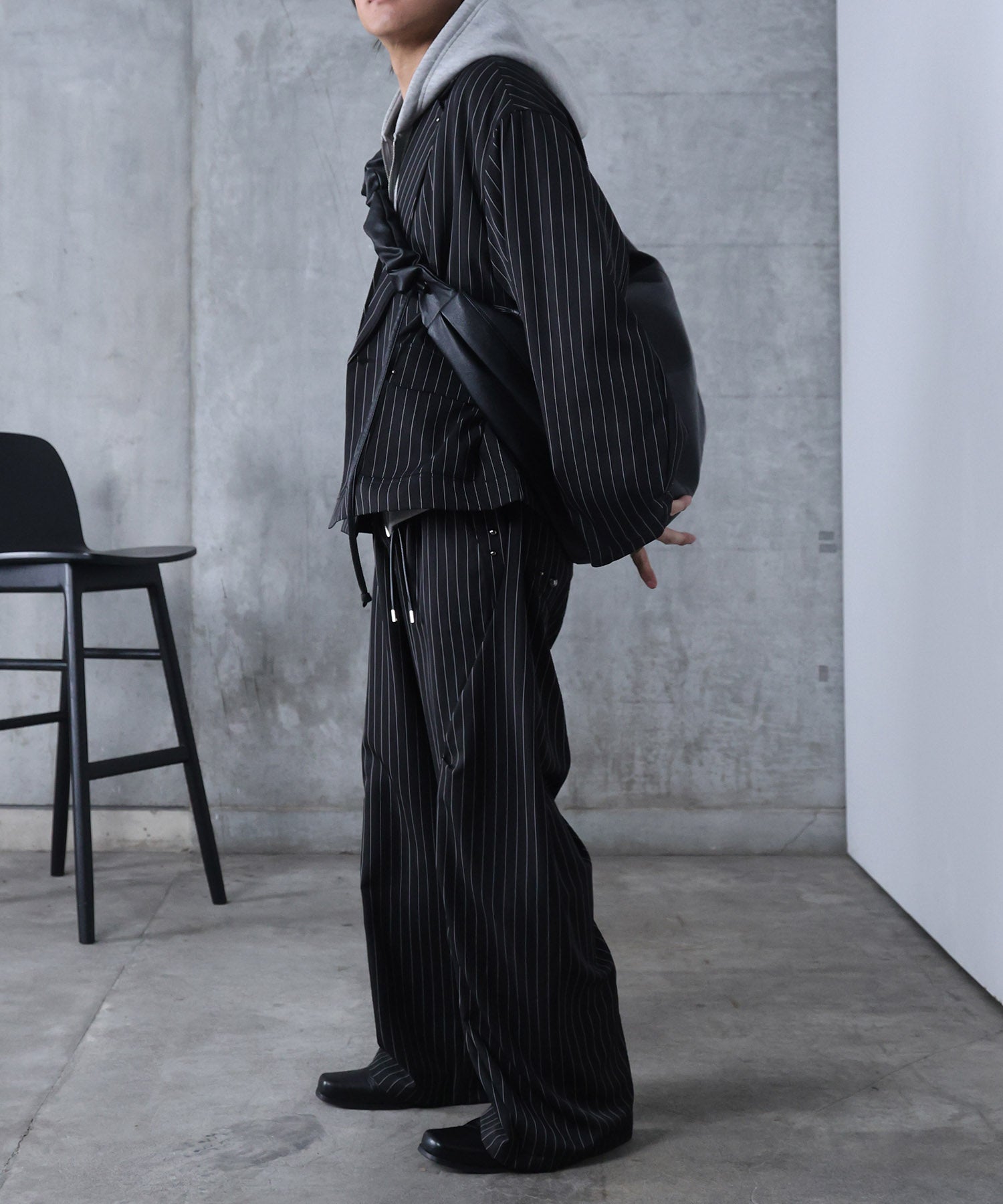 スラックス スタッズ カーブパンツ