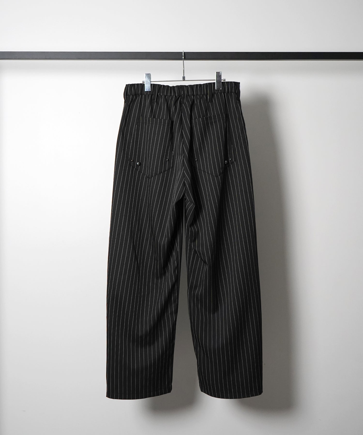 スラックス スタッズ カーブパンツ