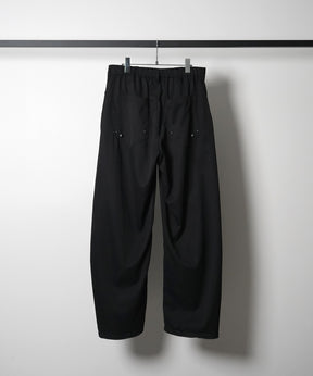 スラックス スタッズ カーブパンツ