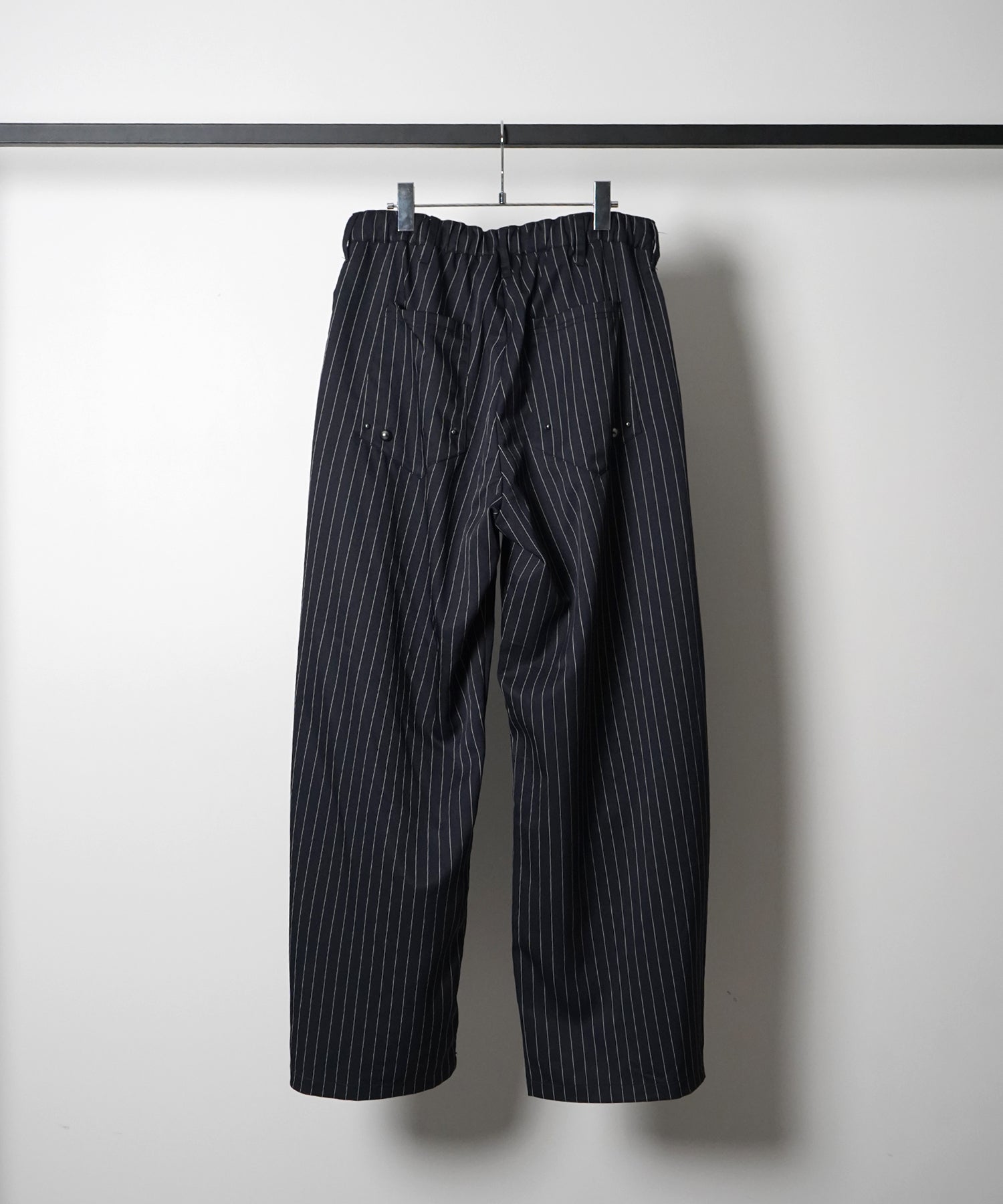 スラックス スタッズ カーブパンツ