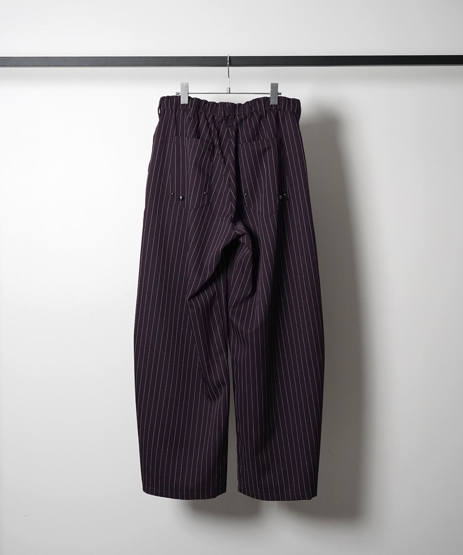 スラックス スタッズ カーブパンツ