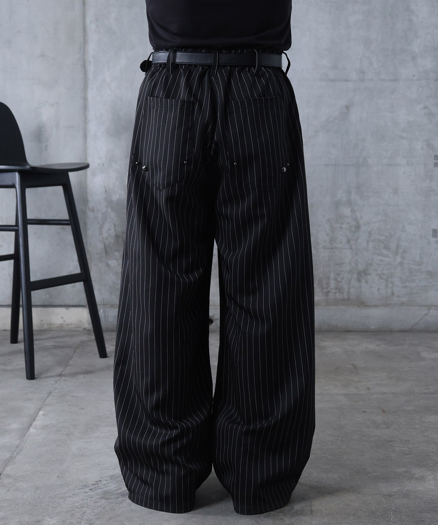 スラックス スタッズ カーブパンツ