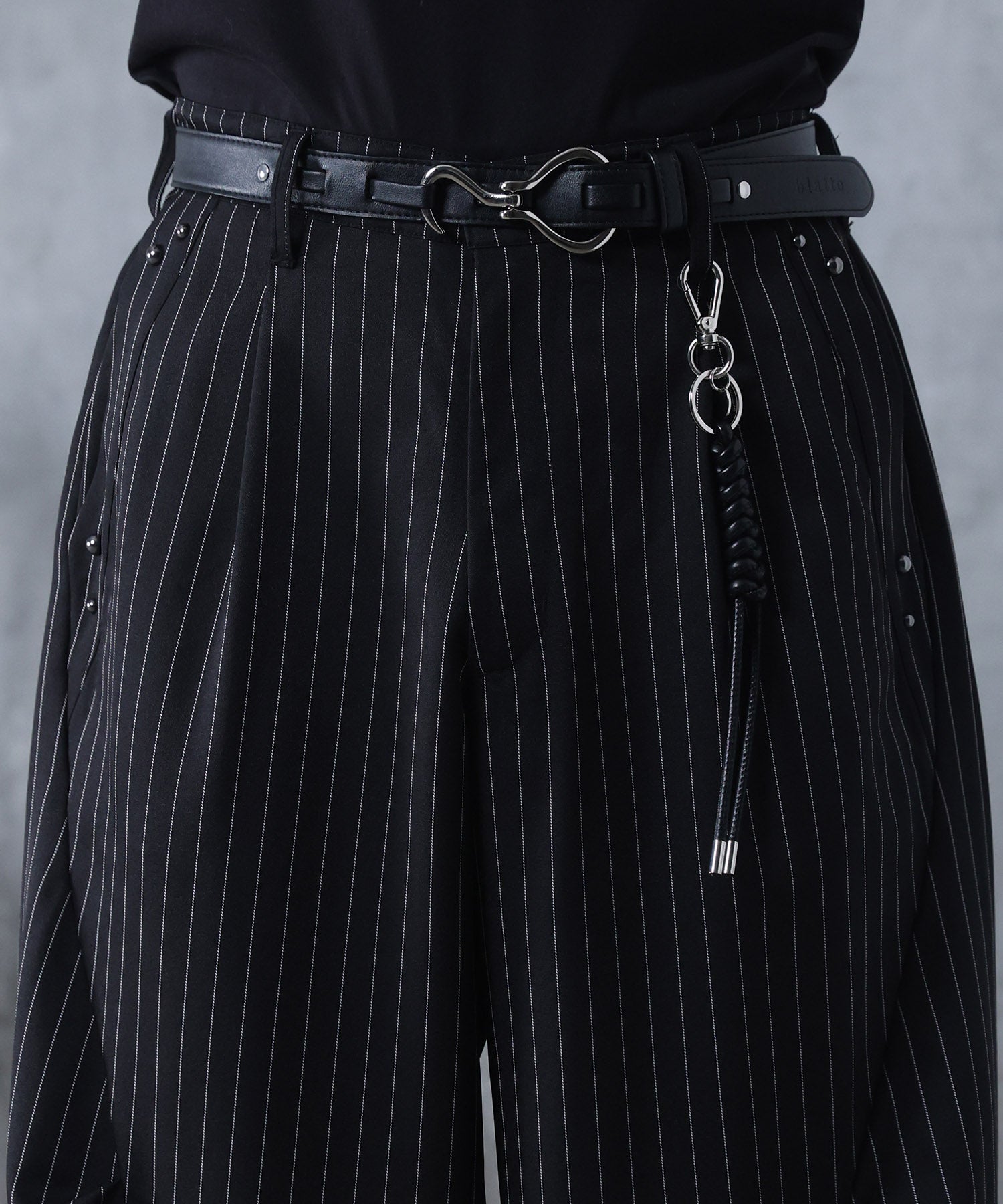 スラックス スタッズ カーブパンツ