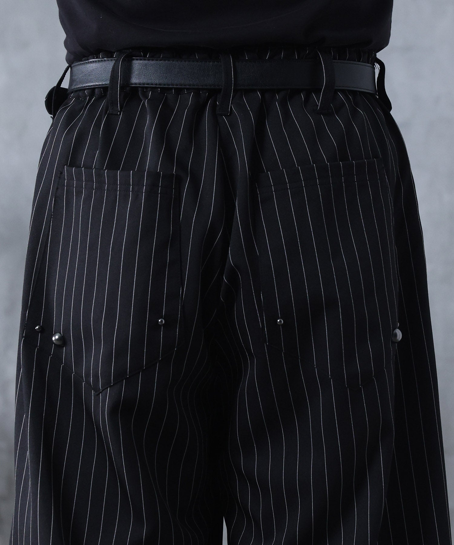 スラックス スタッズ カーブパンツ