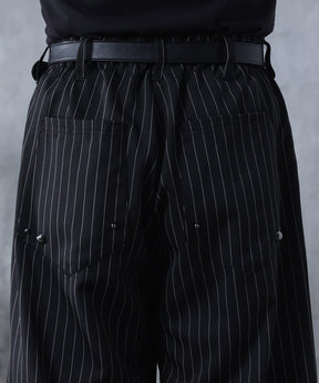 スラックス スタッズ カーブパンツ