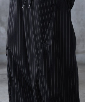 スラックス スタッズ カーブパンツ