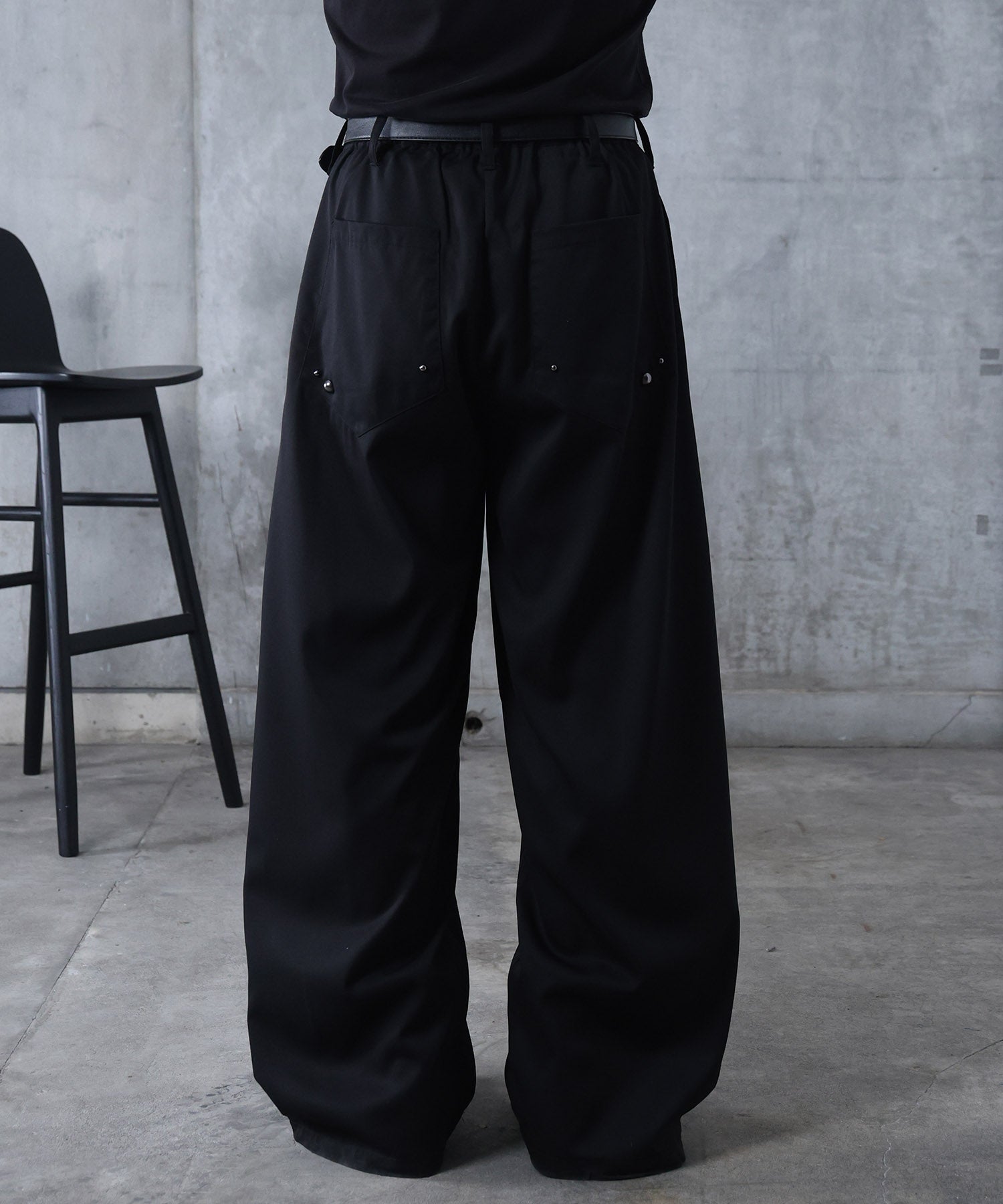 スラックス スタッズ カーブパンツ