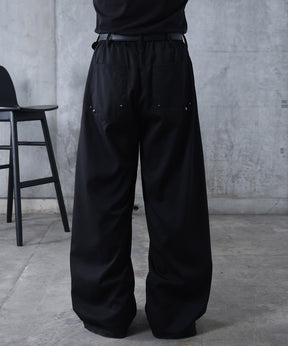 スラックス スタッズ カーブパンツ