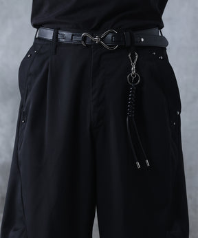 スラックス スタッズ カーブパンツ