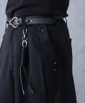 スラックス スタッズ カーブパンツ