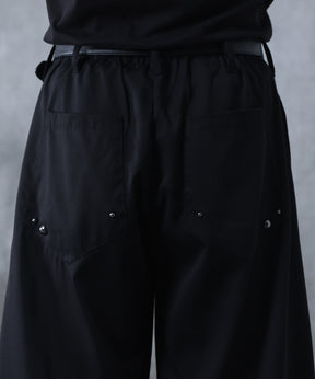 スラックス スタッズ カーブパンツ