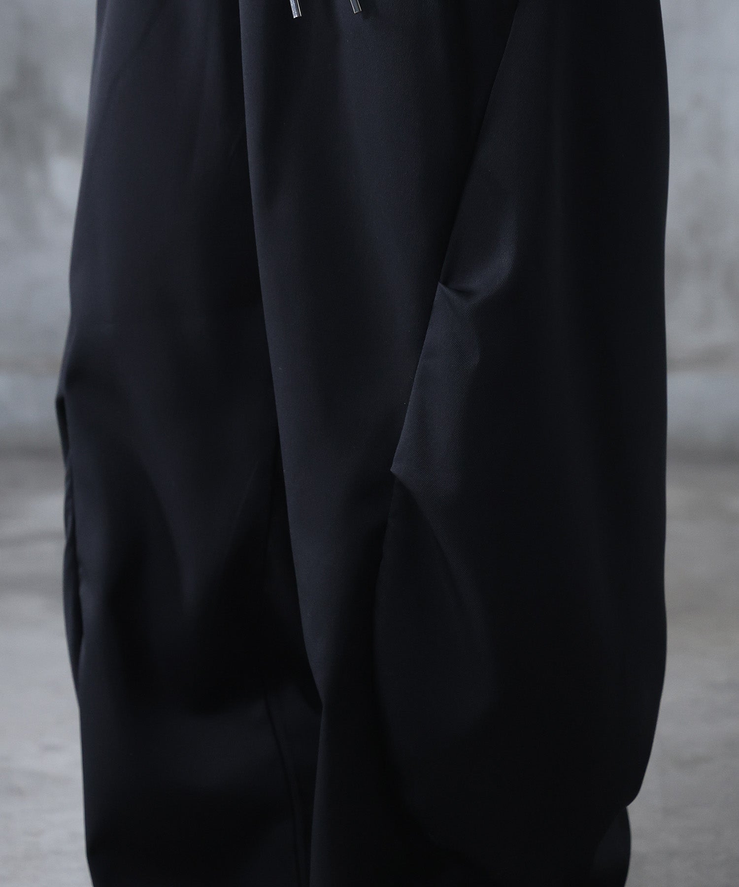 スラックス スタッズ カーブパンツ