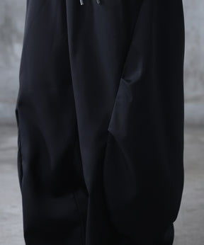 スラックス スタッズ カーブパンツ