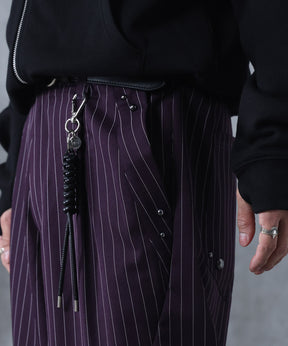 スラックス スタッズ カーブパンツ