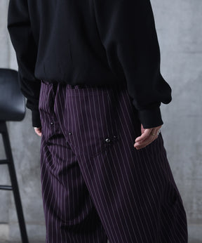 スラックス スタッズ カーブパンツ