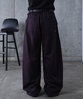 スラックス スタッズ カーブパンツ