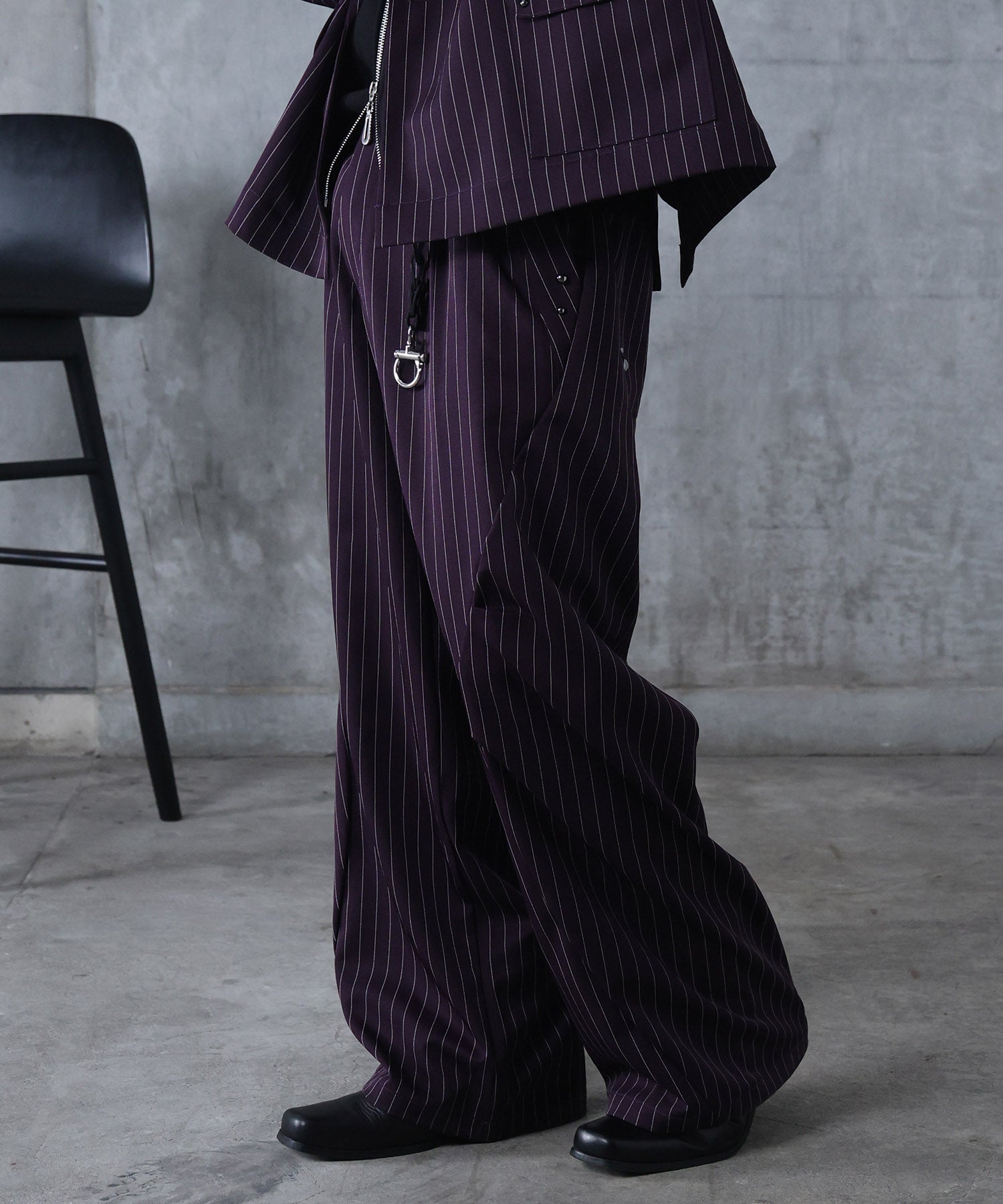 スラックス スタッズ カーブパンツ