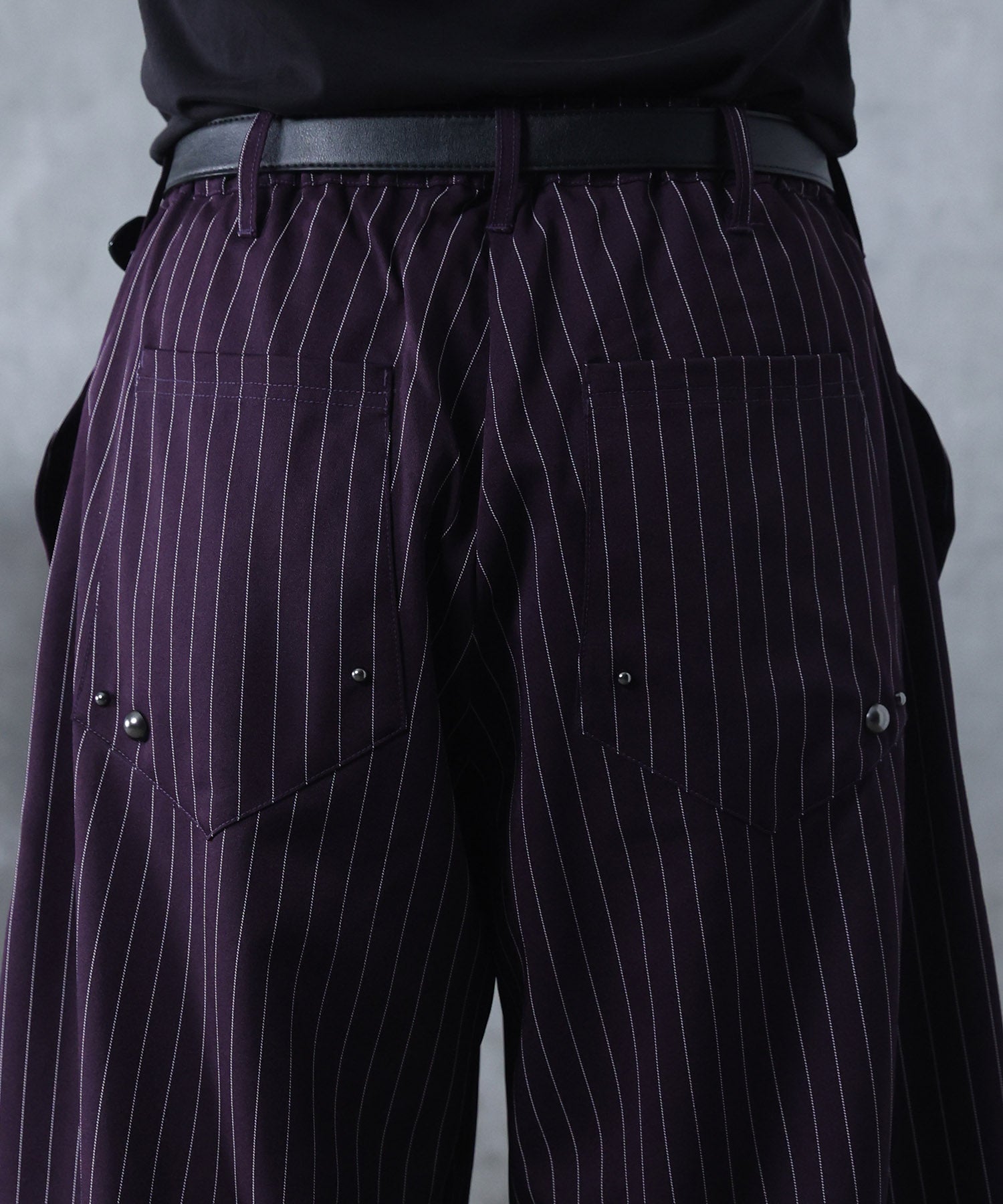 スラックス スタッズ カーブパンツ