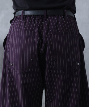 スラックス スタッズ カーブパンツ