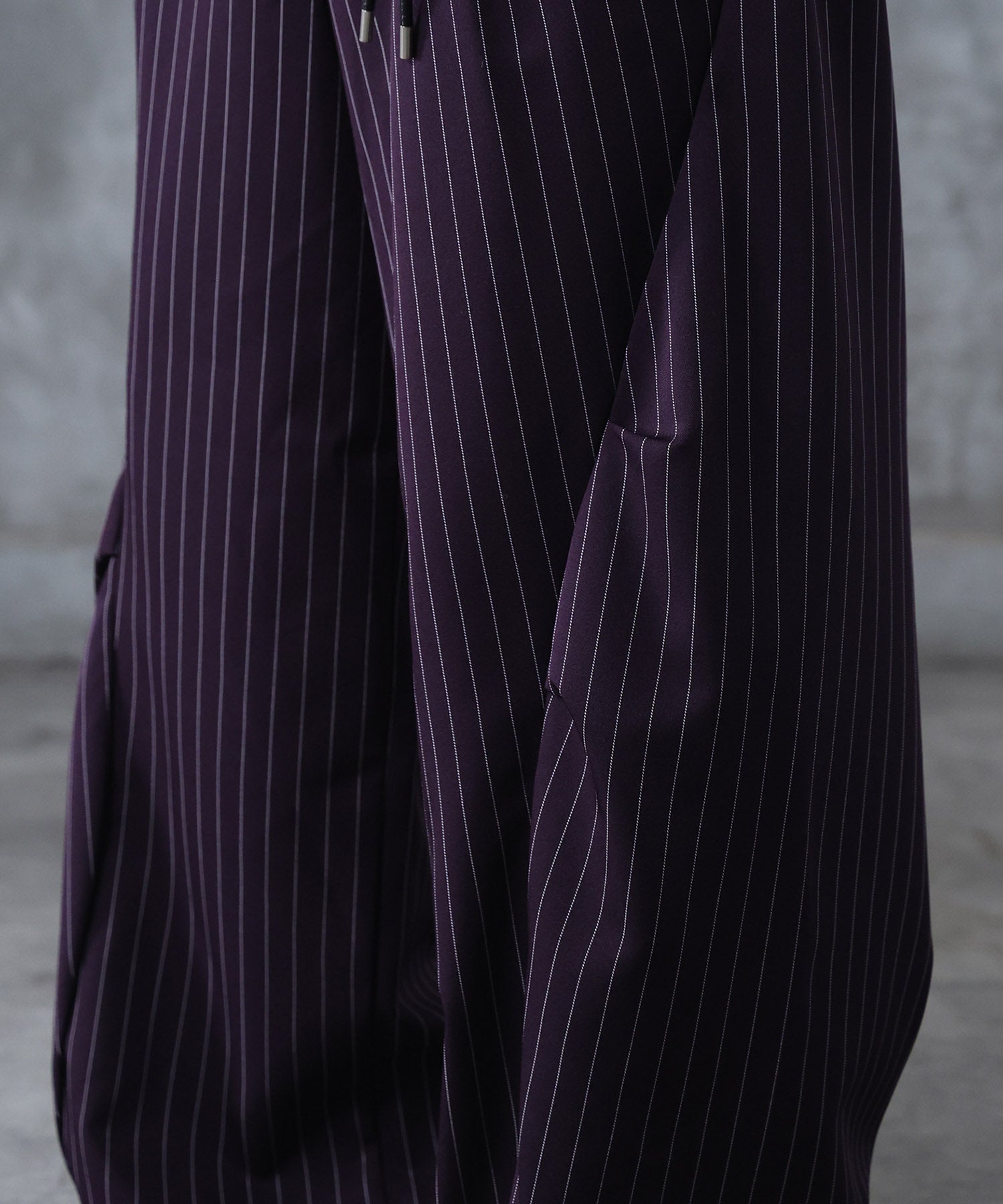 スラックス スタッズ カーブパンツ