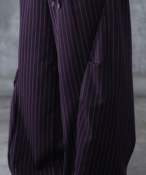 スラックス スタッズ カーブパンツ