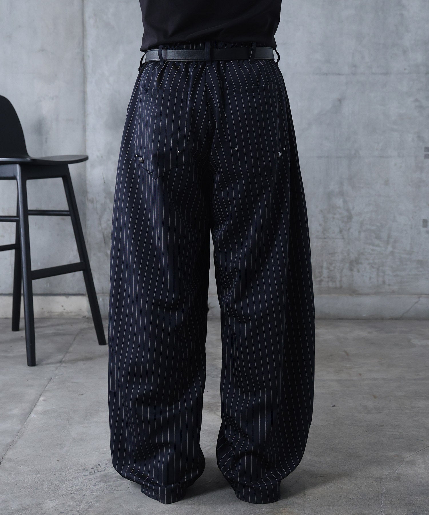 スラックス スタッズ カーブパンツ