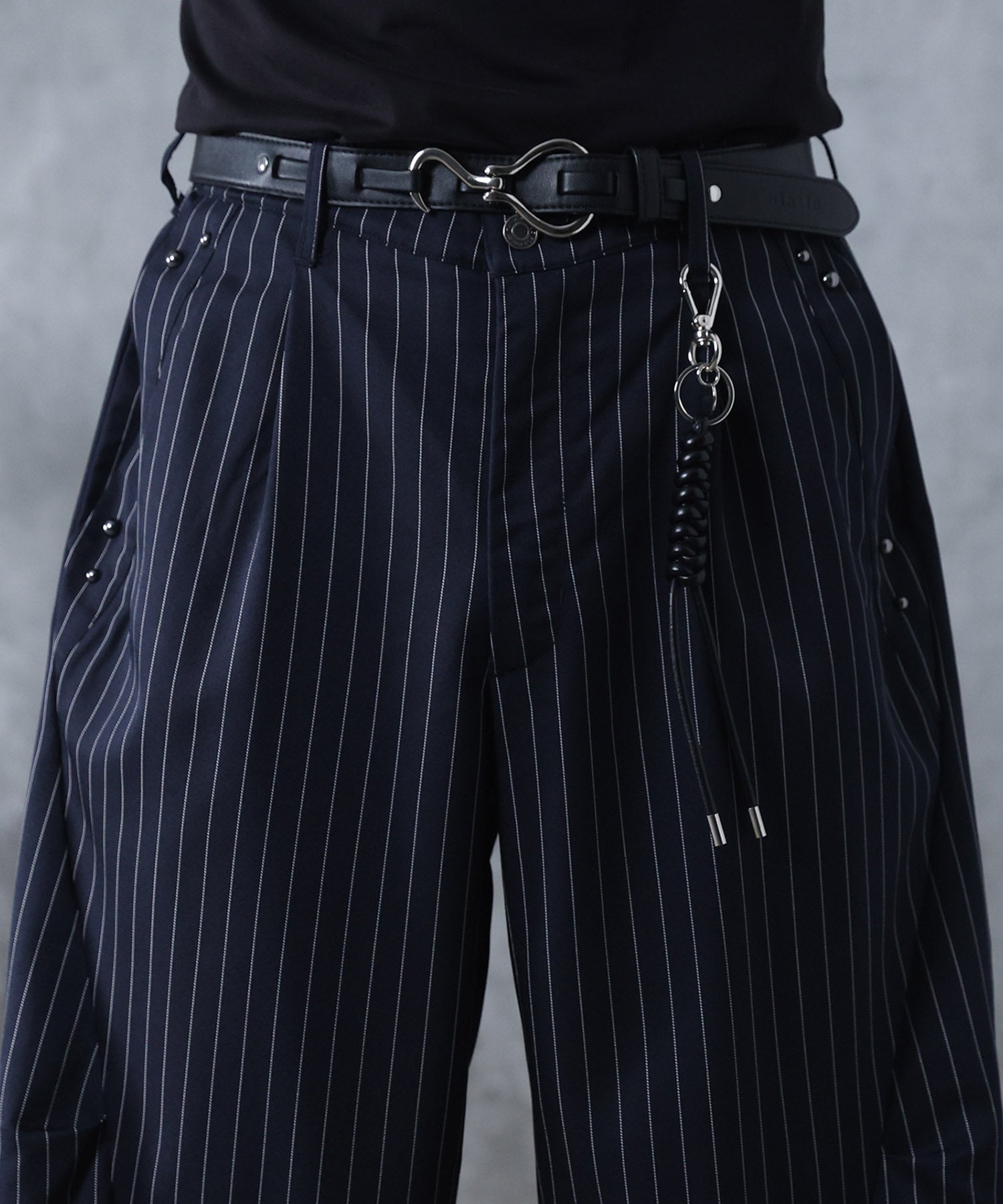 スラックス スタッズ カーブパンツ