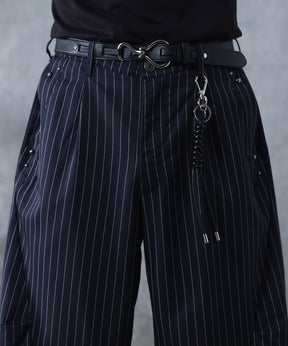 スラックス スタッズ カーブパンツ