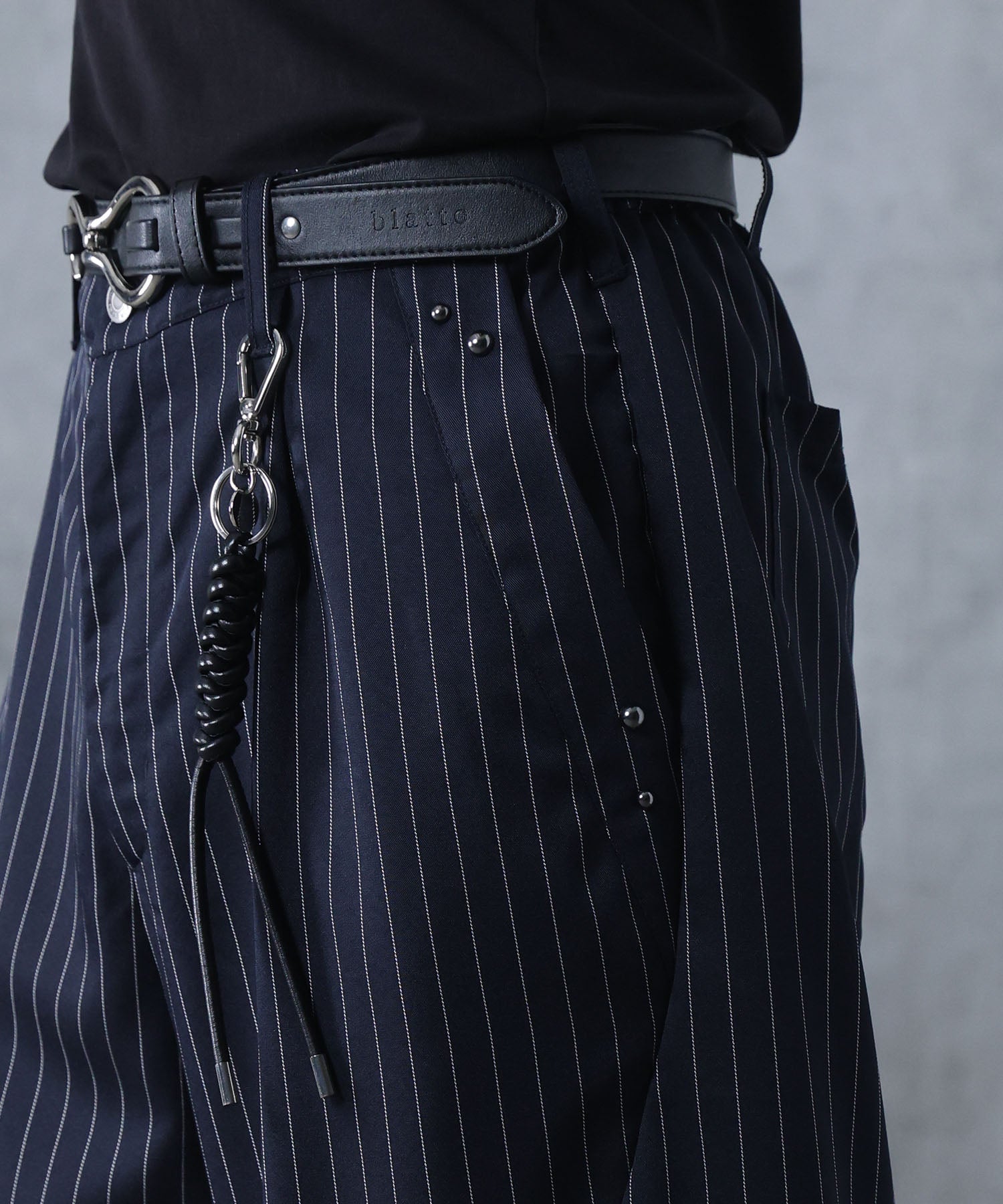 スラックス スタッズ カーブパンツ