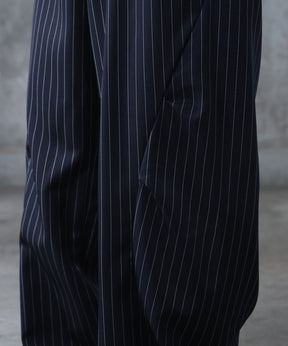 スラックス スタッズ カーブパンツ