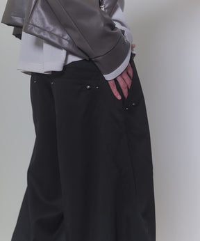 スラックススタッズカーブパンツ